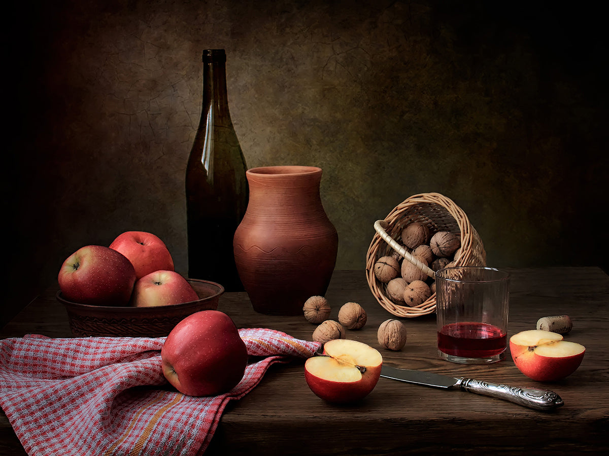 Still life with wine, nuts and apples